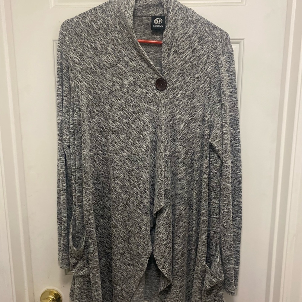 Light gray/white cardigan.